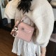 The new fashionable and color-blocking hand-held small square bag for women, the unique and high-quality single-shoulder bag with a retro lock button, and the crossbody bag